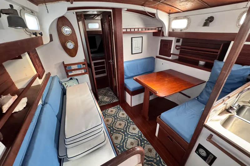 Slide: The Image of Interior of 1980 Dickerson Center Cockpit Ketch with cozy seating and nautical decor. - 37