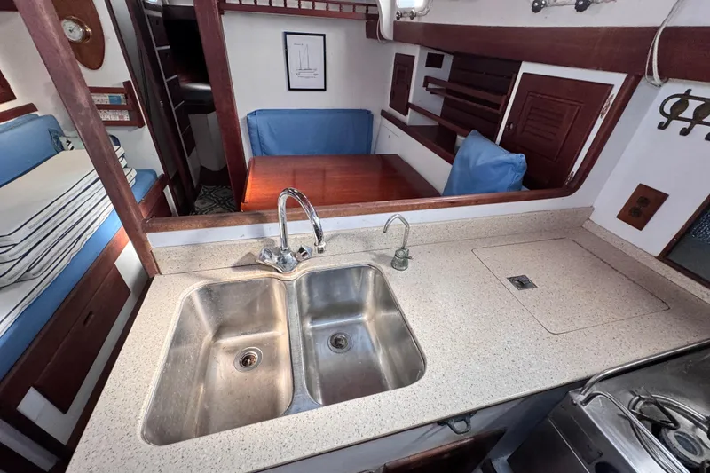 Slide: The Image of Interior of 1980 Dickerson Center Cockpit Ketch with kitchen sink and dining area. - 41