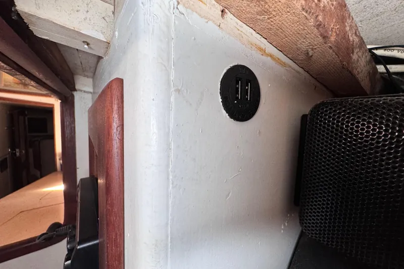 Slide: The Image of Interior of 1980 Dickerson Center Cockpit Ketch with USB ports and speaker. - 48