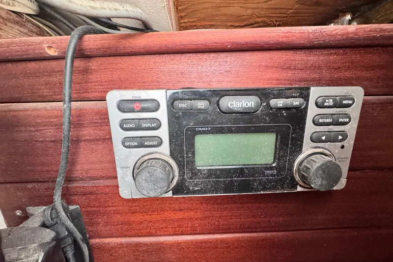 Slide: The Image of Clarion CMD7 stereo system on 1980 Dickerson Center Cockpit Ketch wooden panel. - 53