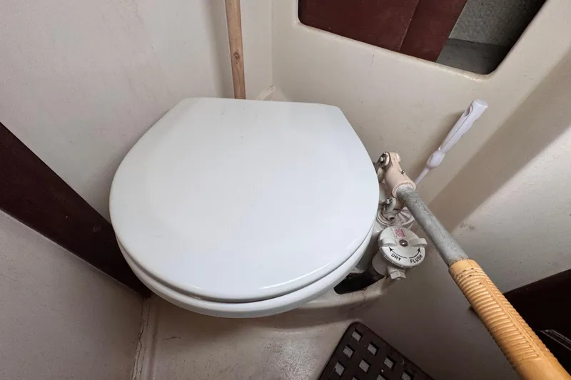 Slide: The Image of Marine toilet in 1980 Dickerson Center Cockpit Ketch sailboat bathroom. - 64