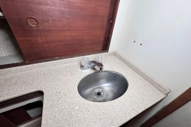 Slide: The Image of Small sink area in 1980 Dickerson Center Cockpit Ketch boat bathroom. - 65