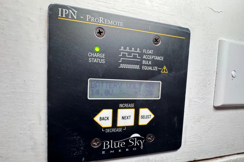 Slide: The Image of IPN ProRemote battery monitor on 1980 Dickerson Center Cockpit Ketch, displaying charge status. - 69