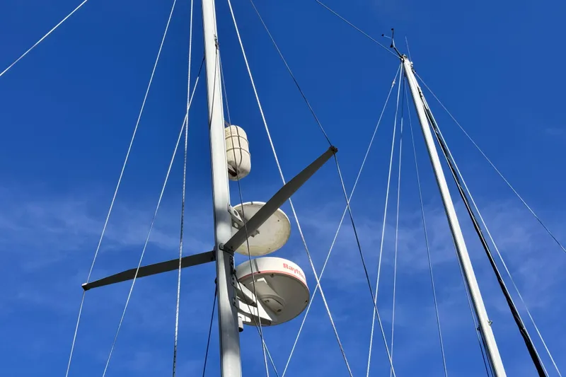 Slide: The Image of Masts and rigging of 1980 Dickerson Center Cockpit Ketch against clear blue sky. - 7