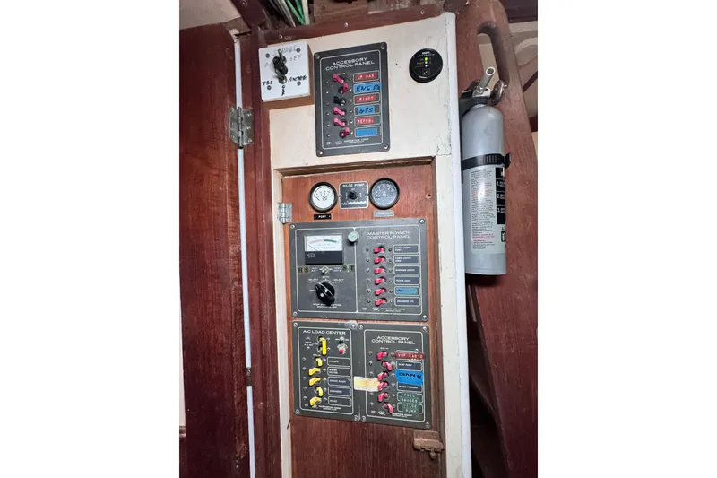 Slide: The Image of Electrical control panel on a 1980 Dickerson Center Cockpit Ketch sailboat interior. - 76