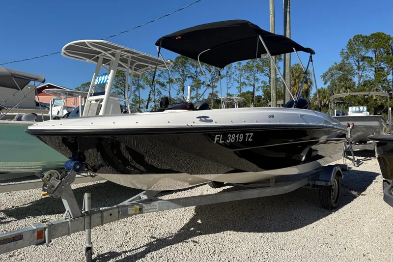 The Image of 2025 Bayliner Element E18 boat on trailer, displayed outdoors. - 0