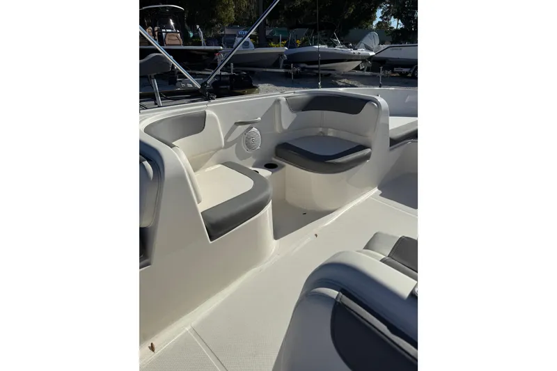 Slide: The Image of 2025 Bayliner Element E18 boat interior with cushioned seating and storage compartments. - 10