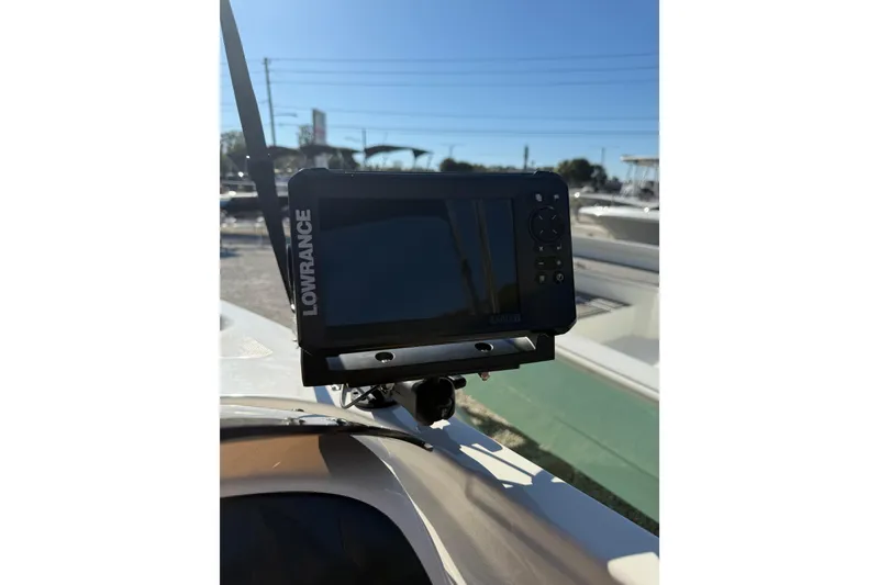 Slide: The Image of Lowrance fish finder on 2025 Bayliner Element E18 boat, sunny day. - 12