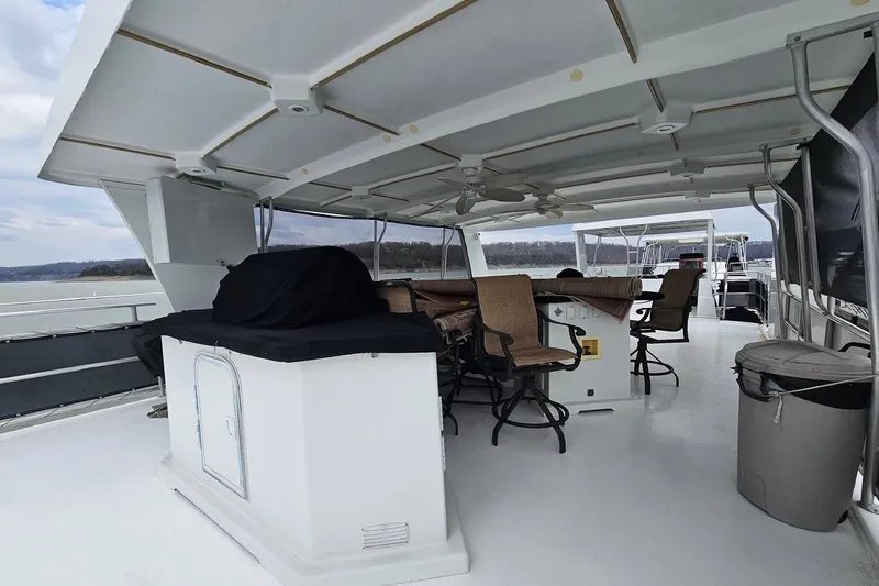 Slide: The Image of Covered deck of 2002 Sharpe 18x85 houseboat with seating and grill. - 12