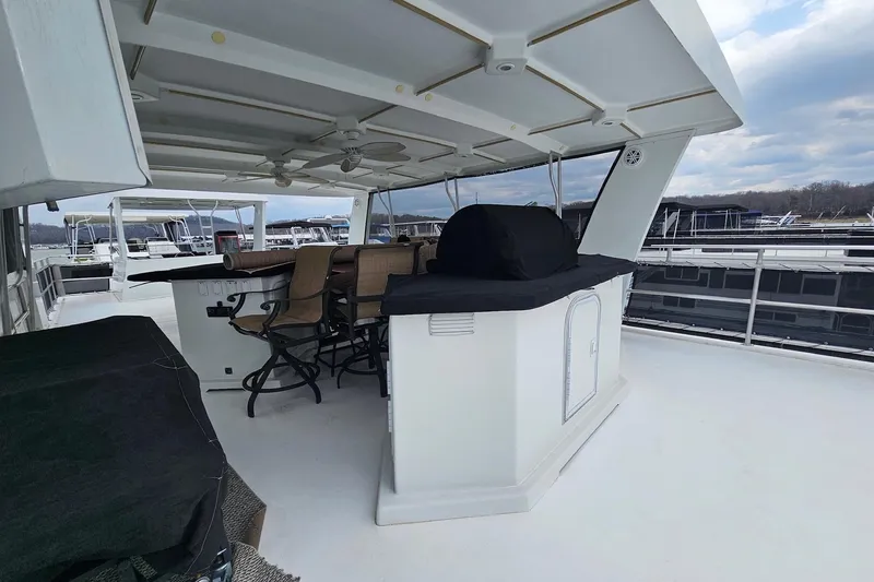 Slide: The Image of Upper deck of 2002 Sharpe 18x85 houseboat with bar and seating area. - 13