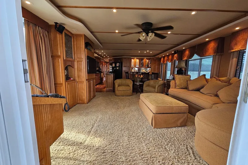 Slide: The Image of Luxurious 2002 Sharpe 18x85 houseboat interior with plush seating and elegant decor. - 18