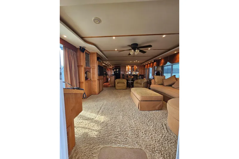 Slide: The Image of Luxurious interior of 2002 Sharpe 18x85 houseboat with cozy seating and elegant decor. - 20