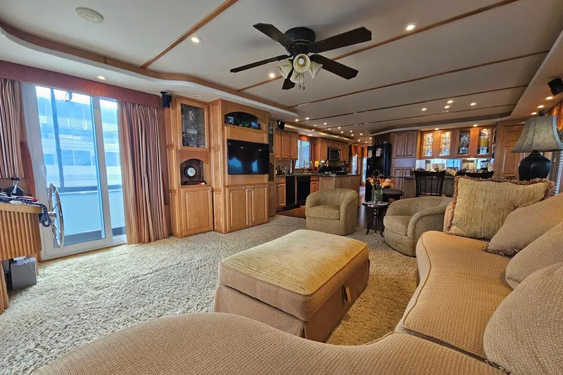 Slide: The Image of Luxurious 2002 Sharpe 18x85 houseboat interior with cozy seating, modern kitchen, and elegant decor. - 21