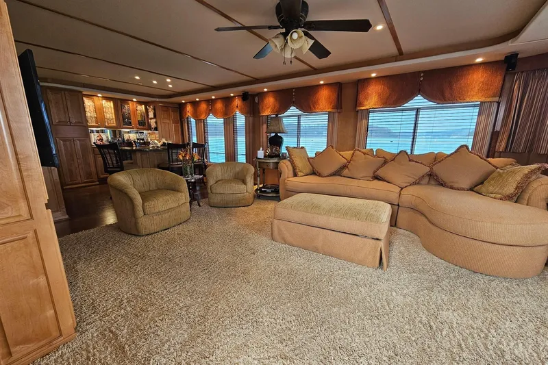 Slide: The Image of Luxurious living area in a 2002 Sharpe 18x85 houseboat with plush seating and elegant decor. - 22