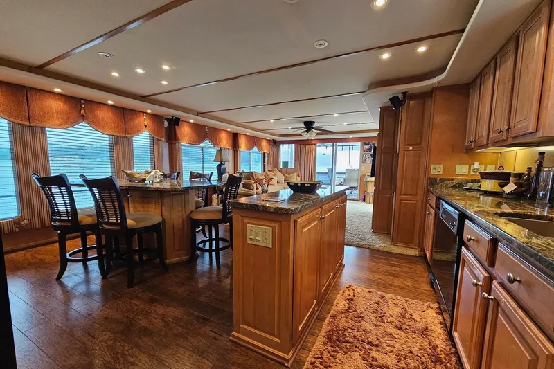 Slide: The Image of Luxurious interior of 2002 Sharpe 18x85 houseboat with elegant kitchen and dining area. - 26