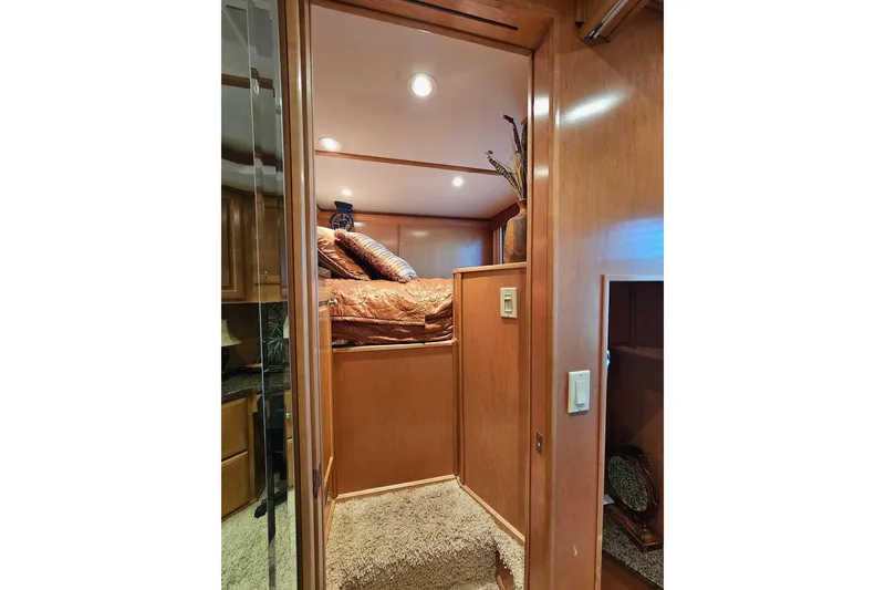 Slide: The Image of Luxurious interior of 2002 Sharpe 18x85 houseboat with cozy bedroom and elegant decor. - 32