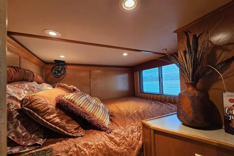 Slide: The Image of Cozy bedroom interior in 2002 Sharpe 18x85 houseboat with elegant decor and soft lighting. - 33