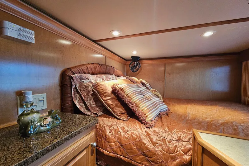 Slide: The Image of Luxurious bedroom interior in 2002 Sharpe 18x85 houseboat with plush bedding and elegant decor. - 34