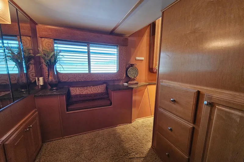 Slide: The Image of Luxurious interior of 2002 Sharpe 18x85 houseboat with wood paneling and cozy seating area. - 38