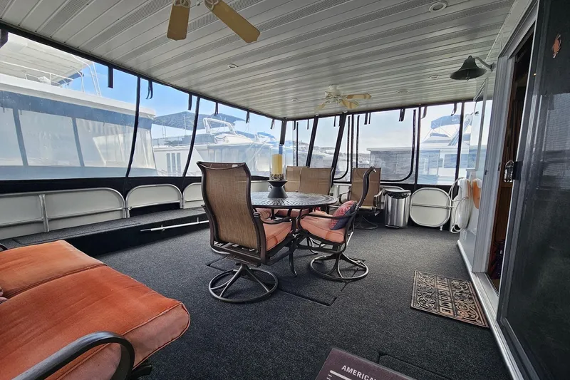 Slide: The Image of Luxurious 2002 Sharpe 18x85 houseboat interior with elegant seating and panoramic windows. - 4