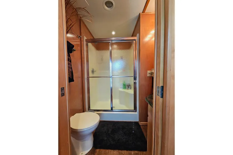 Slide: The Image of Bathroom in 2002 Sharpe 18x85 houseboat with shower and toilet. - 44