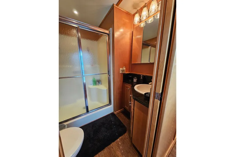 Slide: The Image of Luxurious bathroom in 2002 Sharpe 18x85 houseboat with shower and vanity. - 45