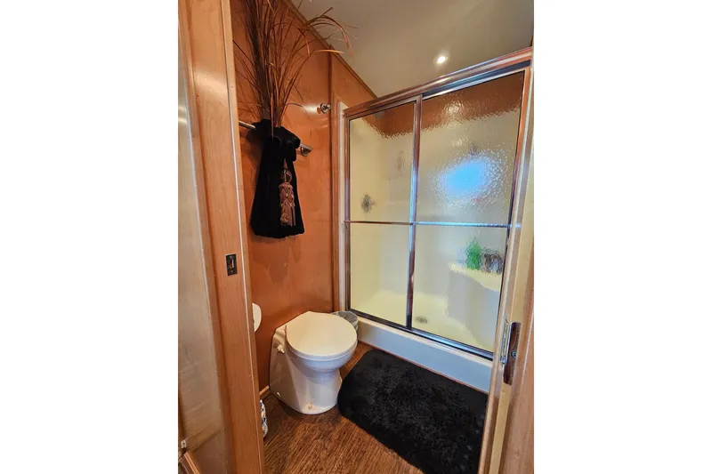 Slide: The Image of Compact bathroom in 2002 Sharpe 18x85 houseboat with shower and toilet. - 46