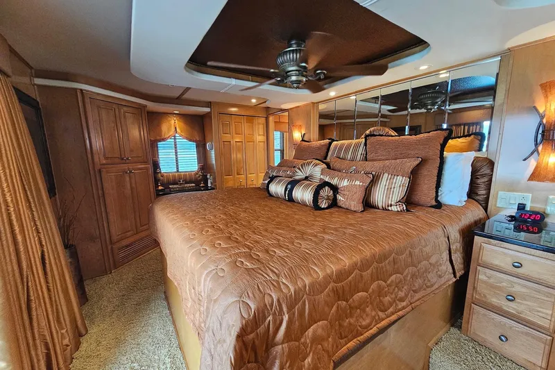 Slide: The Image of Luxurious bedroom in 2002 Sharpe 18x85 houseboat with elegant decor and plush bedding. - 50