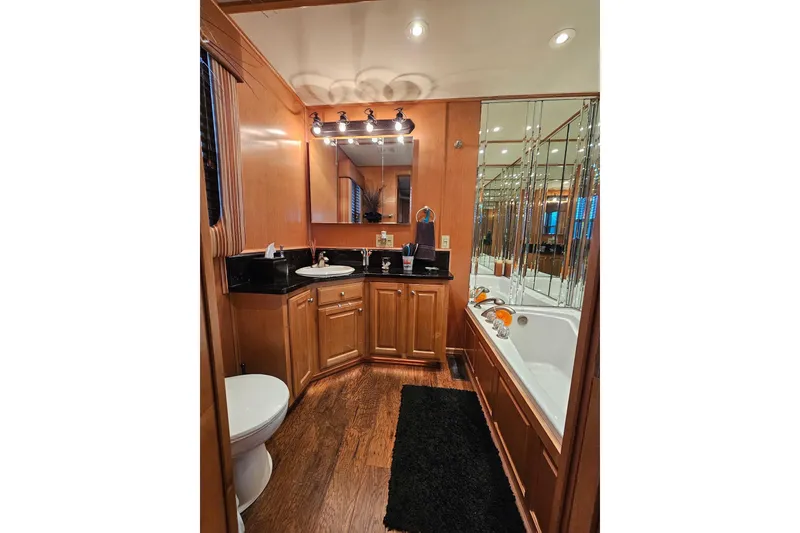Slide: The Image of Luxurious bathroom in 2002 Sharpe 18x85 houseboat with wood accents and modern fixtures. - 53