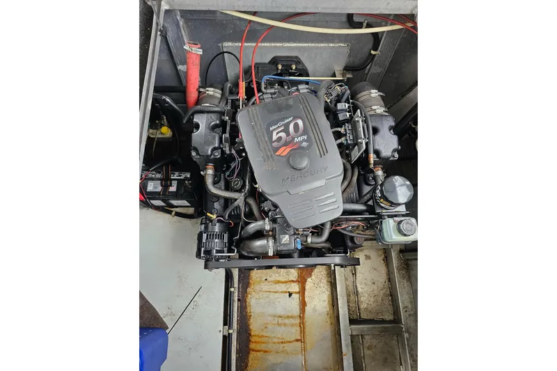 Slide: The Image of Engine compartment of a 2002 Sharpe 18x85 with a Mercury 5.0 MPI motor. - 56