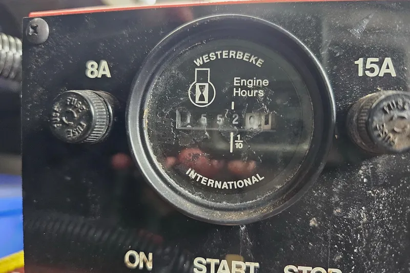 Slide: The Image of Close-up of a Westerbeke engine hour meter on a 2002 Sharpe 18x85. - 59