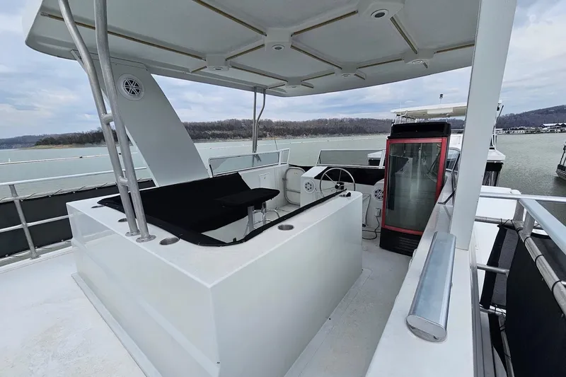 Slide: The Image of Upper deck of 2002 Sharpe 18x85 houseboat with helm and seating area. - 8