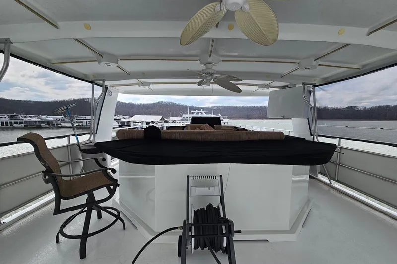 Slide: The Image of Upper deck of 2002 Sharpe 18x85 houseboat with seating and ceiling fans. - 9