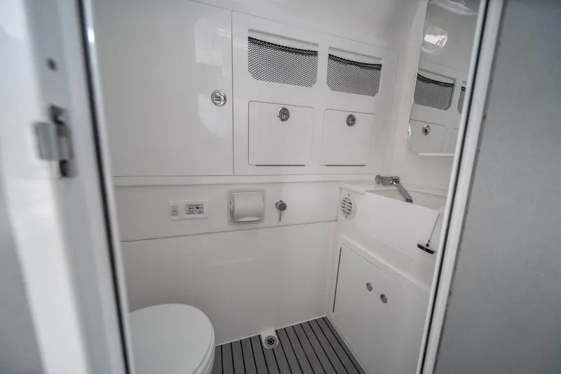 Slide: The Image of Modern bathroom interior in 2026 Fountain 43 SCX boat, featuring sleek design and compact amenities. - 10