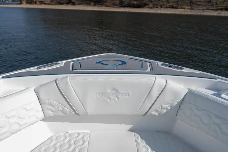 Slide: The Image of 2026 Fountain 43 SCX boat interior with white seating, on calm water. - 16