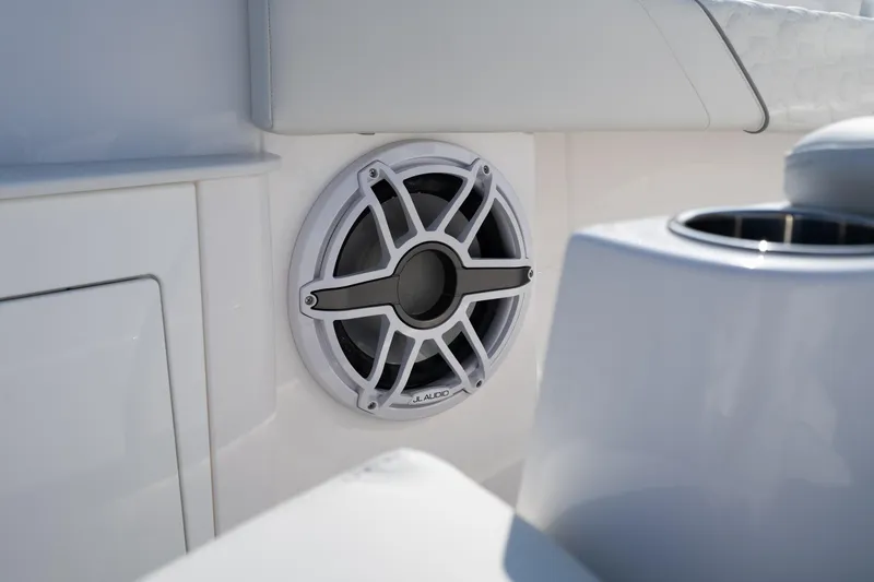 Slide: The Image of Speaker on 2026 Fountain 43 SCX boat, featuring sleek white interior design. - 20