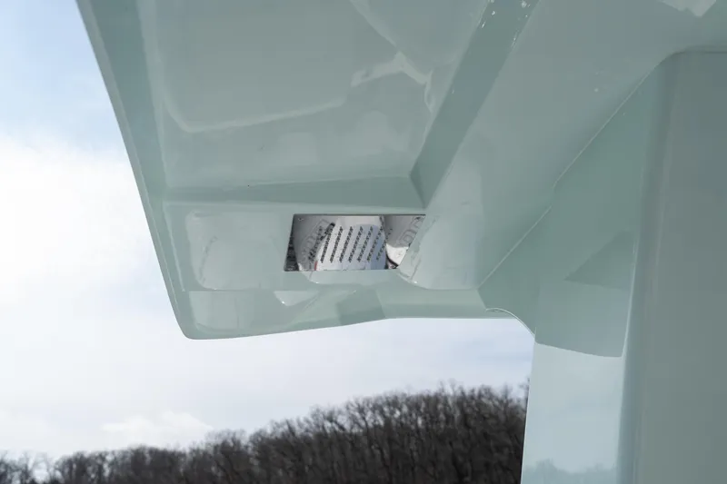 Slide: The Image of Close-up of 2026 Fountain 43 SCX boat's sleek hull design against a cloudy sky. - 22