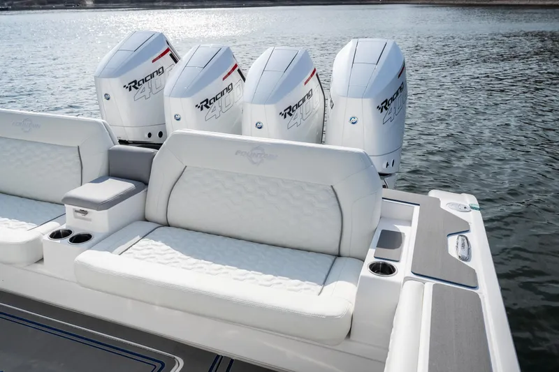 Slide: The Image of 2026 Fountain 43 SCX boat with four powerful outboard engines on a calm lake. - 29