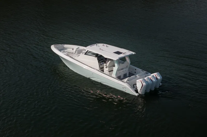 Slide: The Image of 2026 Fountain 43 SCX boat cruising on calm water, showcasing sleek design and powerful engines. - 3