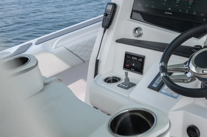 Slide: The Image of 2026 Fountain 43 SCX boat cockpit with steering wheel and navigation controls. - 39