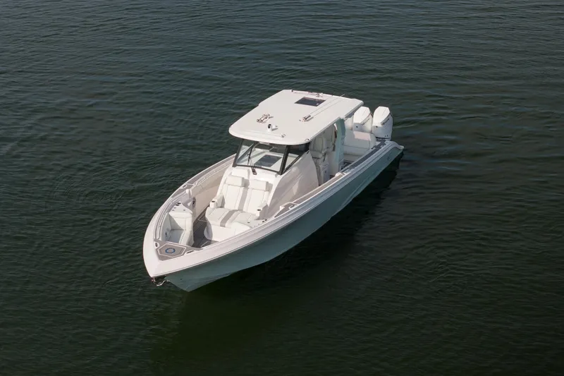 Slide: The Image of 2026 Fountain 43 SCX boat on calm water, showcasing sleek design and modern features. - 4