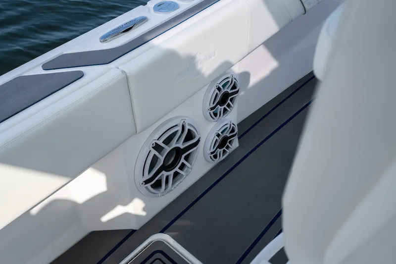 Slide: The Image of 2026 Fountain 43 SCX boat interior with sleek white seating and built-in speakers. - 41