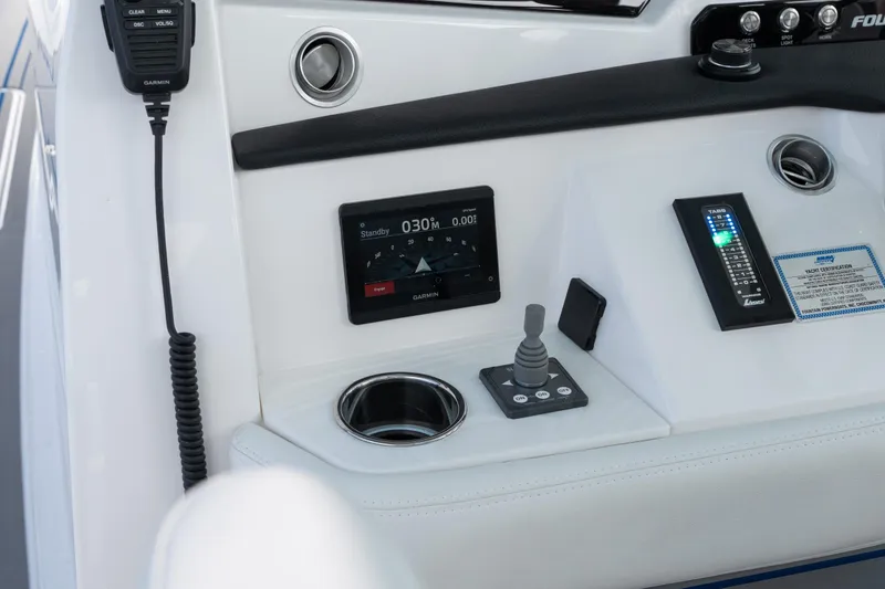 Slide: The Image of Control panel of 2026 Fountain 43 SCX boat with Garmin display and joystick. - 44