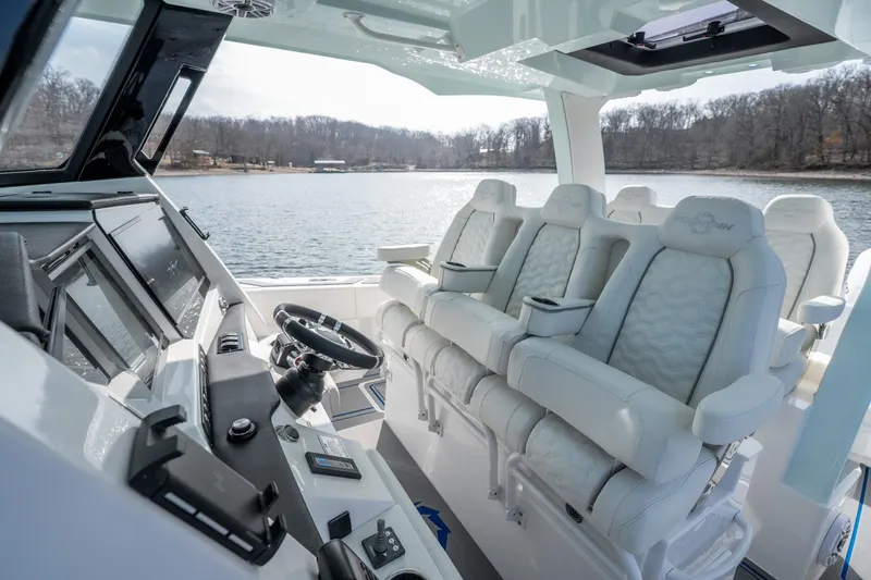 Slide: The Image of Interior of 2026 Fountain 43 SCX boat with luxurious seating and advanced controls. - 47
