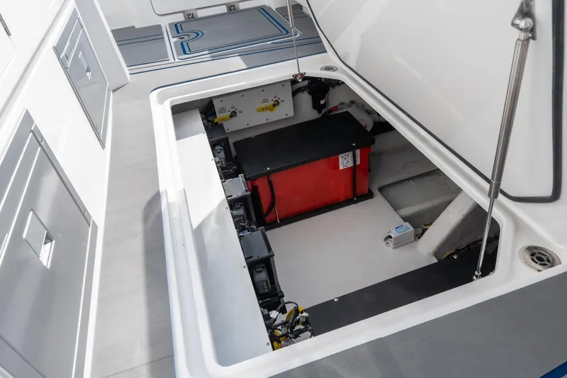 Slide: The Image of Open storage compartment in 2026 Fountain 43 SCX boat, showcasing interior equipment. - 48