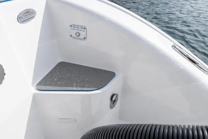 Slide: The Image of 2026 Fountain 43 SCX boat detail with water droplets on the deck near the water. - 49