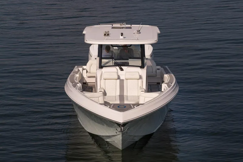 Slide: The Image of 2026 Fountain 43 SCX boat on calm water, front view. - 5