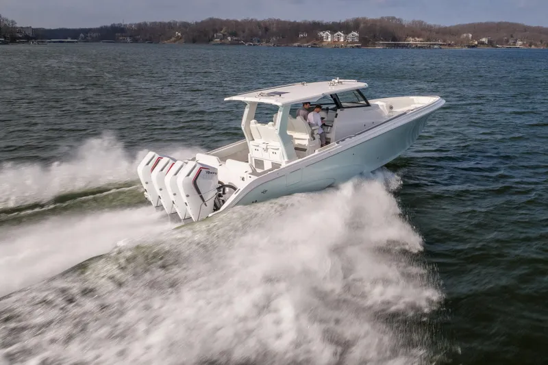 Slide: The Image of 2026 Fountain 43 SCX speedboat cruising on a lake with powerful engines. - 53