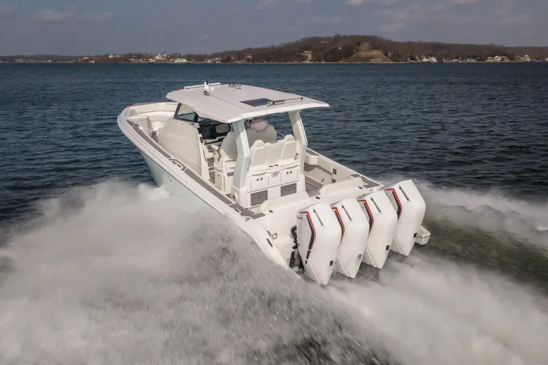 Slide: The Image of 2026 Fountain 43 SCX boat cruising on open water with powerful engines. - 56