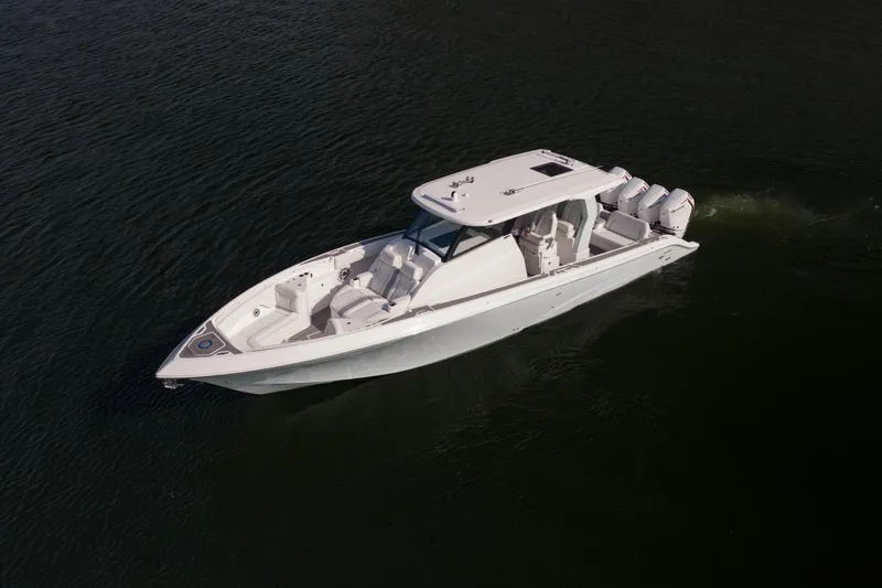 Slide: The Image of 2026 Fountain 43 SCX boat cruising on calm water, showcasing sleek design and powerful engines. - 59